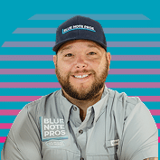 Blue Note Pros plumber in a company cap and work shirt
