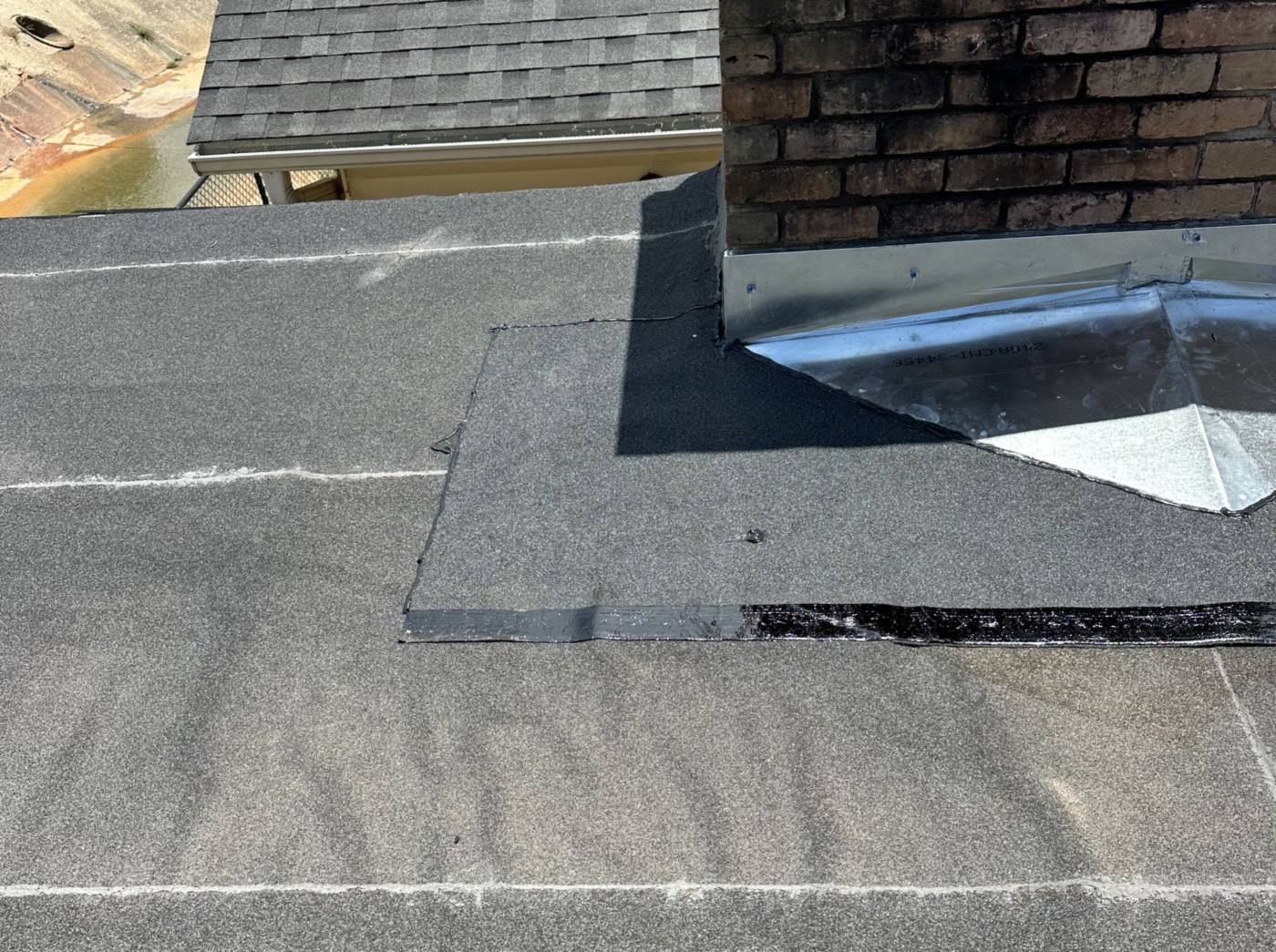 Chimney cricket and flashing roof repair on a Shreveport home