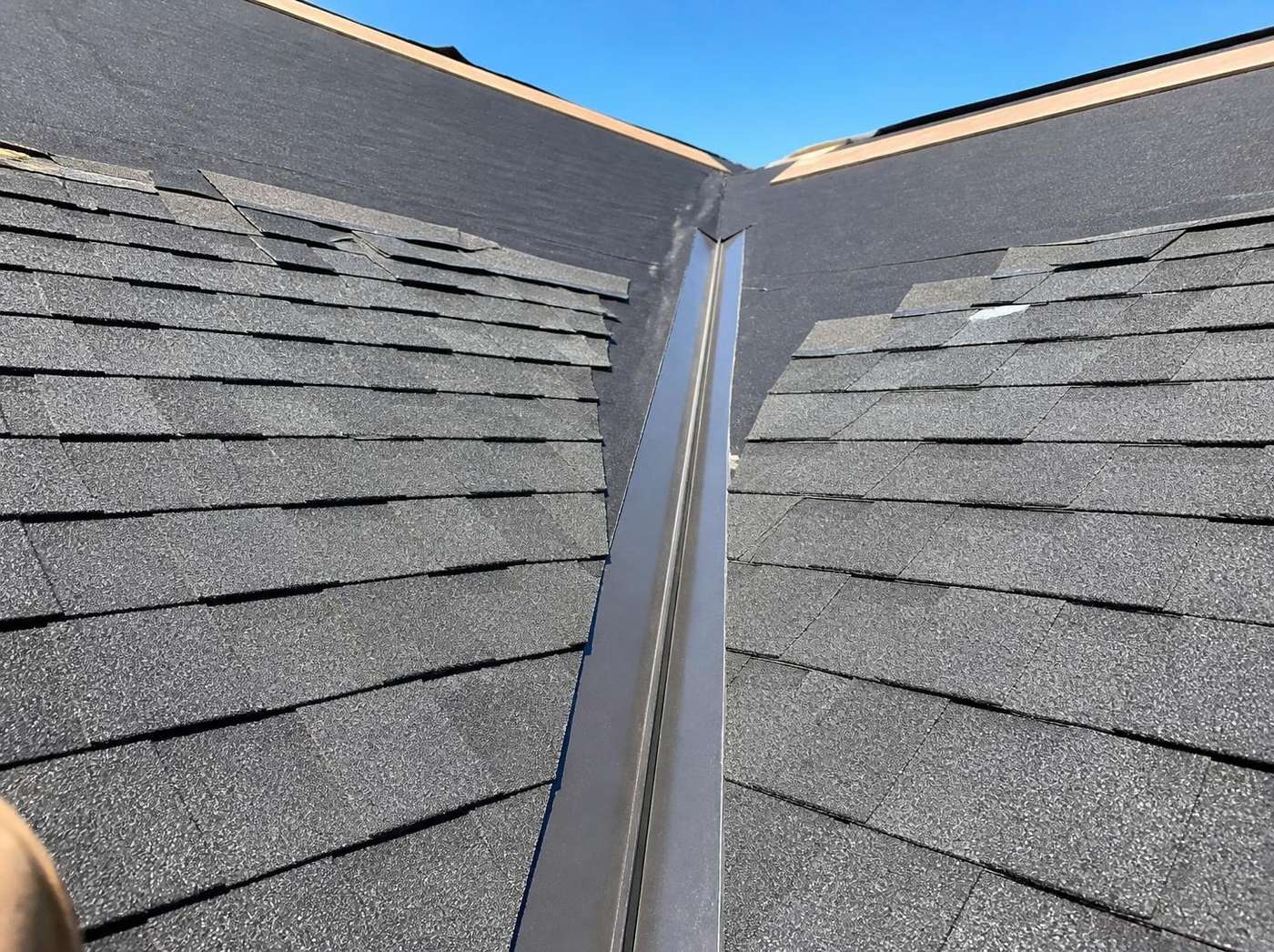 Metal valley flashing with new shingles on a Shreveport roof