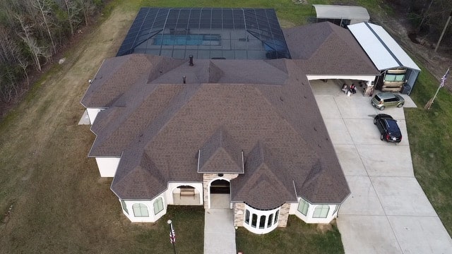 Aerial view of a large multi-hip shingle roof showing the roof squares measured for a replacement in Shreveport