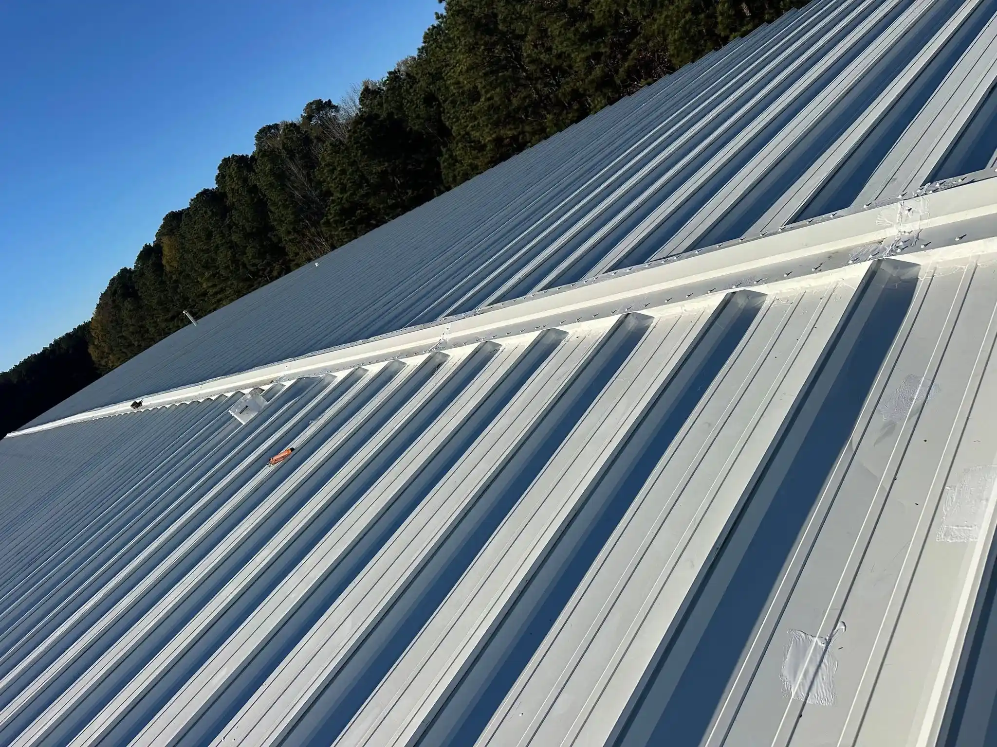 Metal roof installation on a sloped roof in Shreveport, LA.