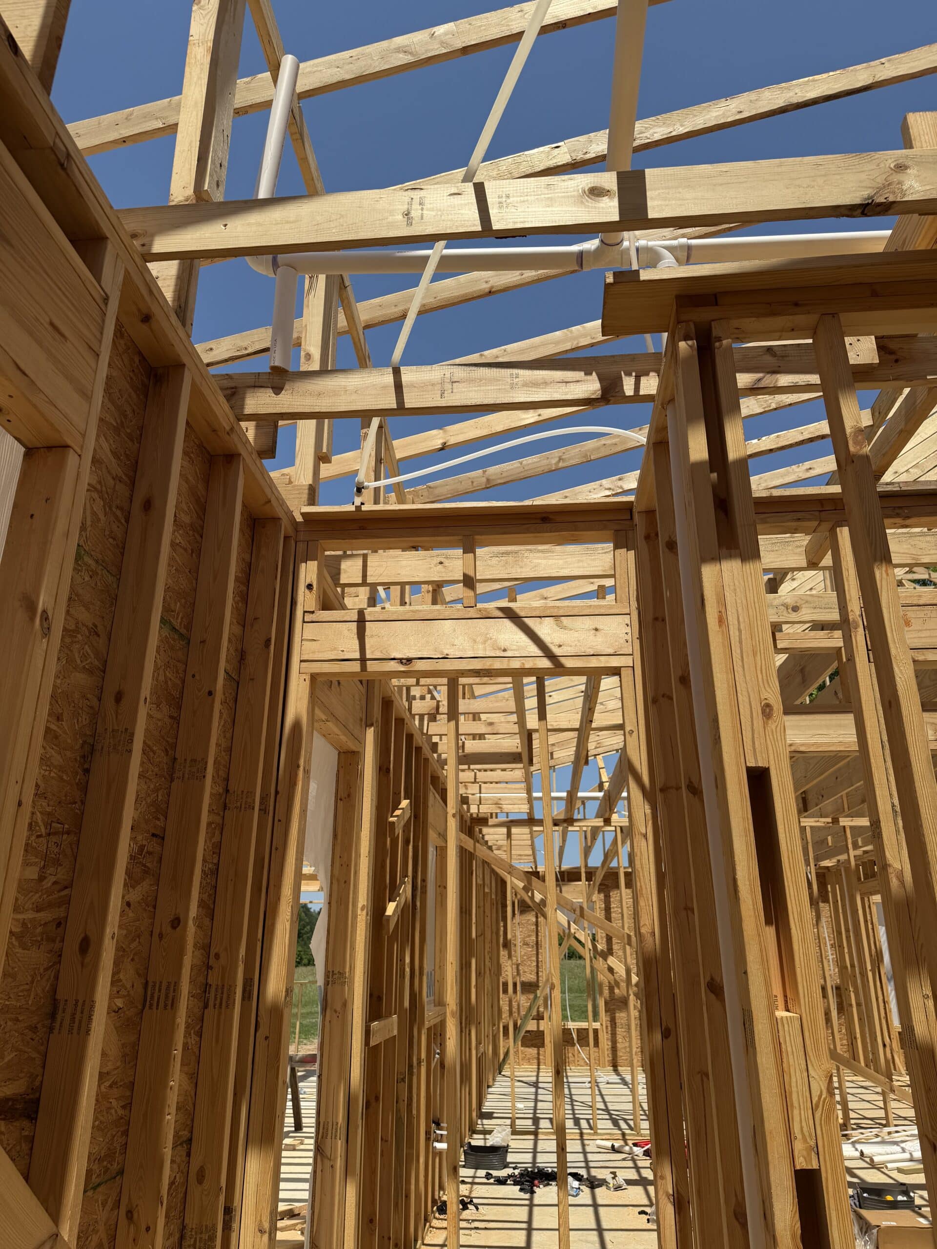 Blue Note Pros construction plumbing rough-in during new home framing.